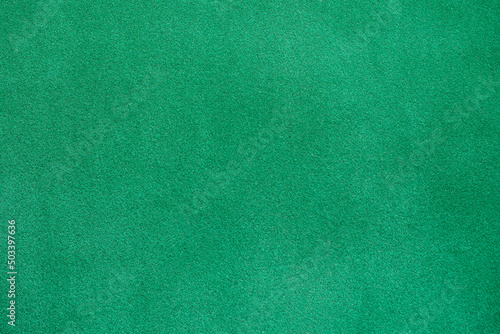 Green fabric, surface. Abstract homogeneous background, texture.