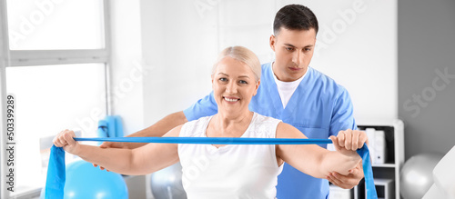 Physiotherapist working wit...