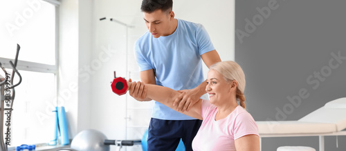 Physiotherapist working wit...