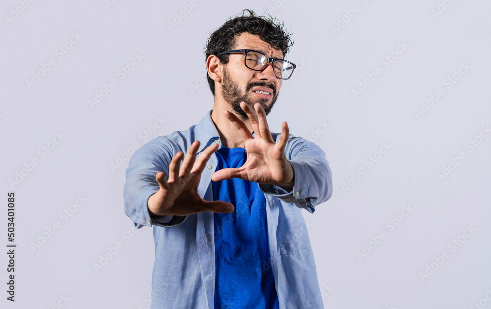 a man with rejection expression, man with scared expression on his face making frightened gesture with his palms, scared man asking you to stop a man with rejection expression, man with scared expression on his face making frightened gesture with his palms, scared man asking you to stop