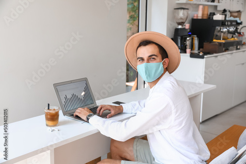 Young man in face mask and ...