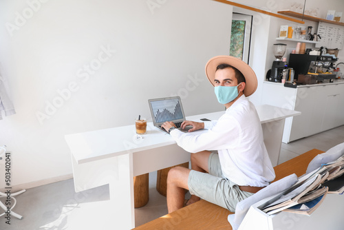 Young man in medical mask w...