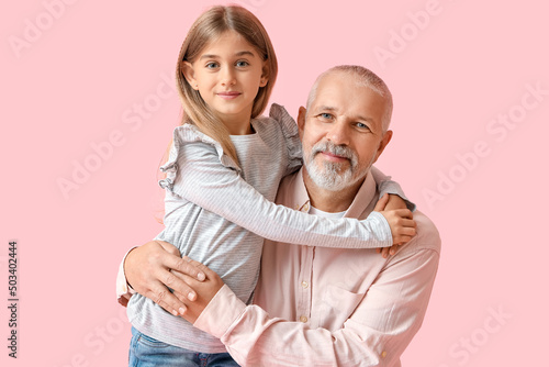 Little girl with her grandf...