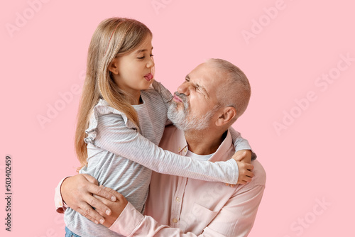 Little girl with her grandf...