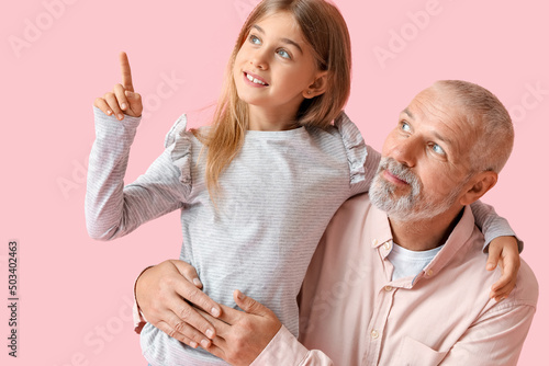 Little girl pointing at som...