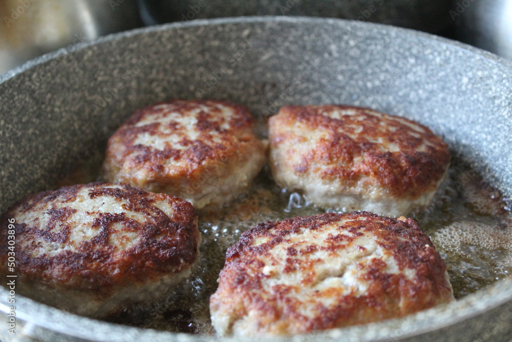 pork cutlets are fried in the kitchen