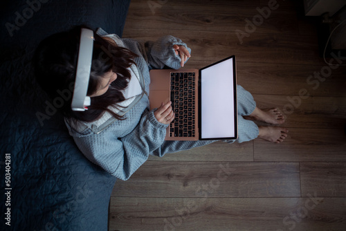 woman freelancer working at home sitting on the floor