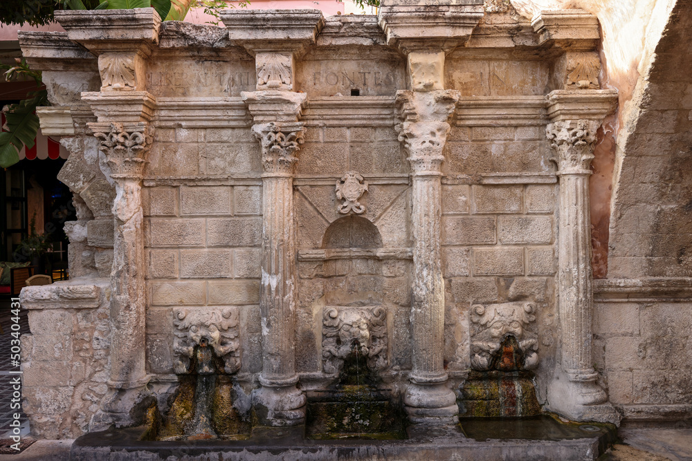 Rimondi Fountain in Old Town of Rethymnon in hot summer day. Crete, Greece.
