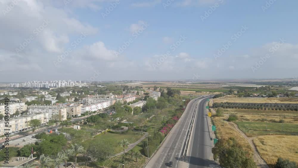 aerial shot above a traffic at netivot city, israel aerial shot above a traffic at netivot city, israel