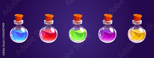 Magic potion bottles, glass jars with alchemy elixir or poison. Vector cartoon icons set of round vials with wooden corks with different color liquid potions isolated on background
