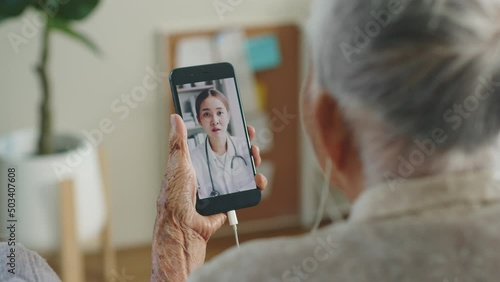 Asian senior woman grey hair 80-90s video call with doctor, telemedicine telehealth concept