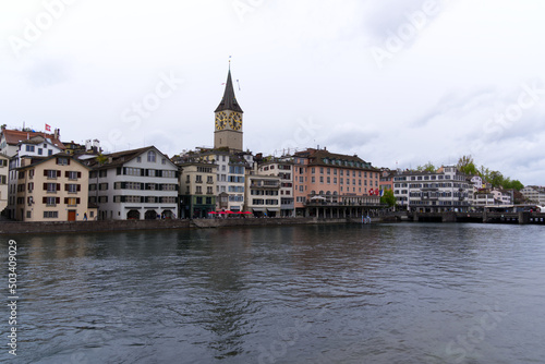 Old town of City of Zürich with river Limmat in the foreground on a rainy spring day. Photo taken April 24th, 2022, Zurich, Switzerland.