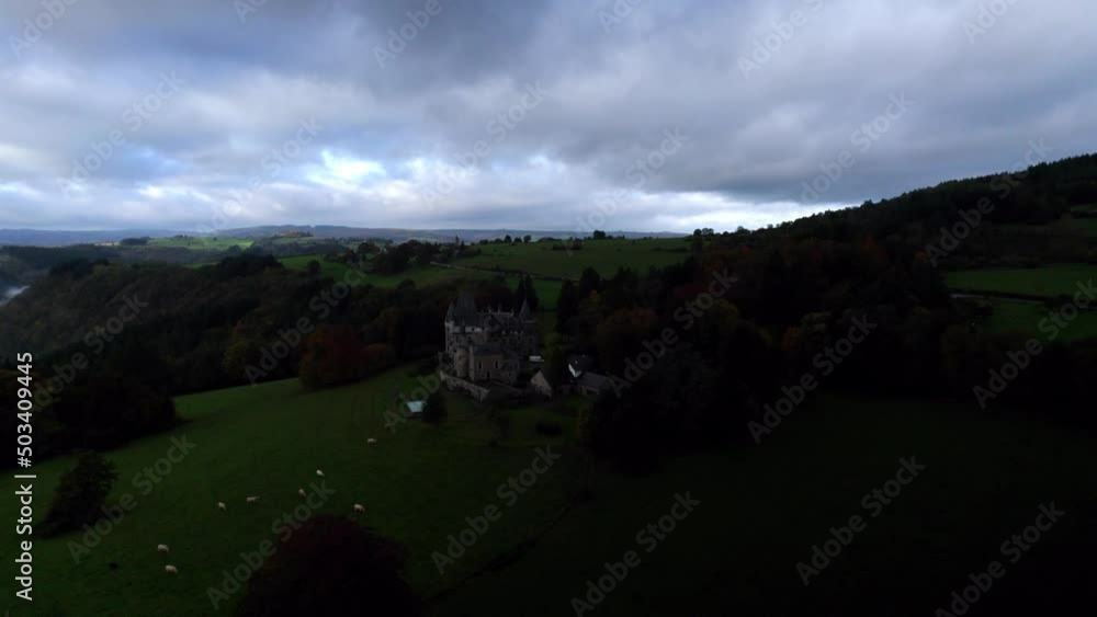 Aerial view of beautiful castle Château de Froidcour, in the middle of the Belgian Ardennes, surrounded by forests and meadows with cows. Aerial view of beautiful castle Château de Froidcour, in the middle of the Belgian Ardennes, surrounded by forests and meadows with cows.