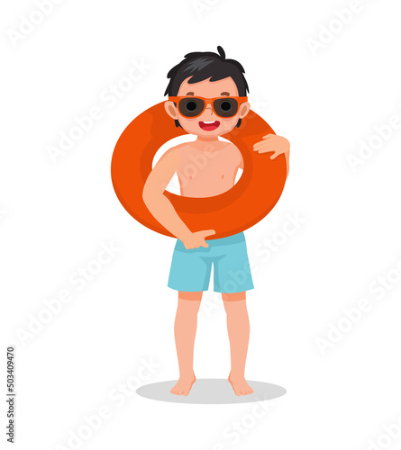 cute little boy with swimsuit and sun glasses holding inflatable rubber ring circle around his neck having fun on summer time