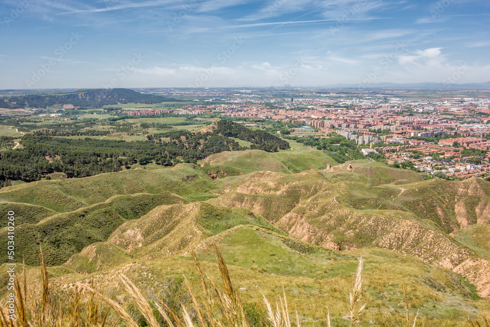 View of the park of the hills, in the foreground, Alcalá de Henares, on the right, and Madrid, in the background, from the Ecce Homo, located in the city of Alcalá de Henares.