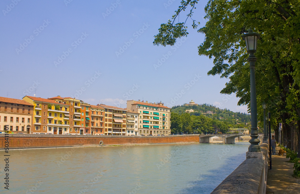 Cituscape with bridge across Adige river in Verona, Italy