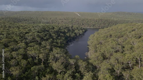 Blue Lake In North Stradbroke. Sacred Freshwater Lake Surrounded By Dense Forest In Queensland, Australia. aerial photo