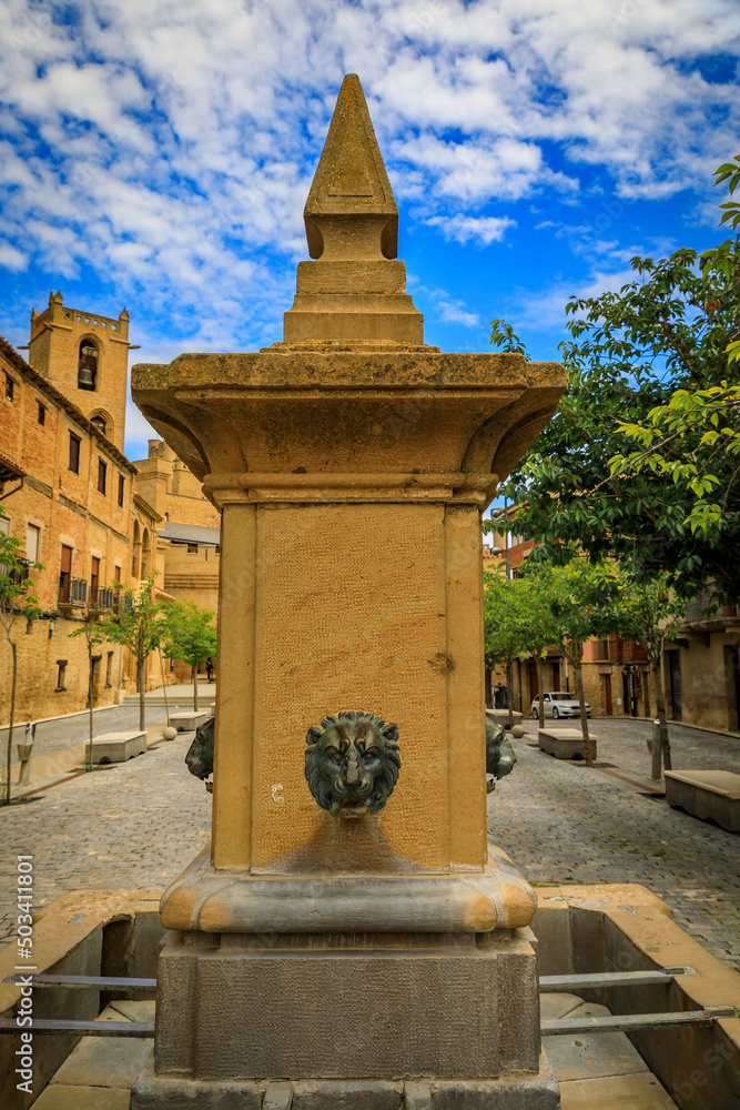 Medieval drinking fountain on town square by Royal Palace castle in Olite, Spain Medieval drinking fountain on town square by Royal Palace castle in Olite, Spain