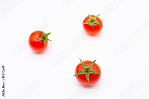 Cherry on a white background. Vegetables for salad