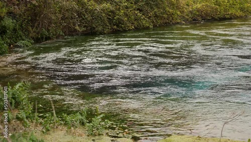 Blue Eye spring (Syri i Kalter), a more than fifty metre deep natural pool with clear, fresh water, near Sarande in Vlore Country in southern Albania. High quality 4k footage photo