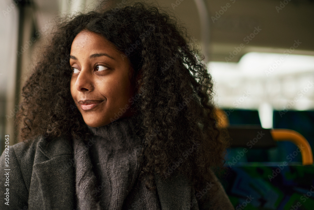© Johnér - Woman in bus looking through window © Johnér - Woman in bus looking through window