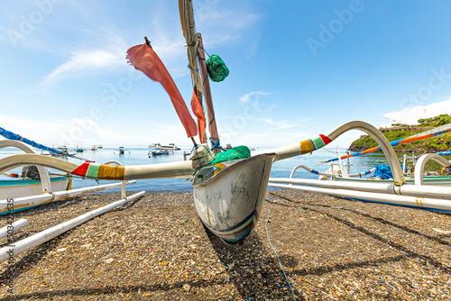 Traditional fishing boat on the beach of Amed in Bali, Indonesia photo