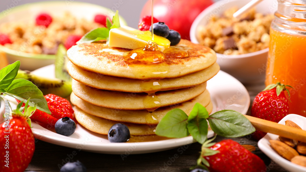 pancakes with berries fruits, butter and maple syrup pancakes with berries fruits, butter and maple syrup