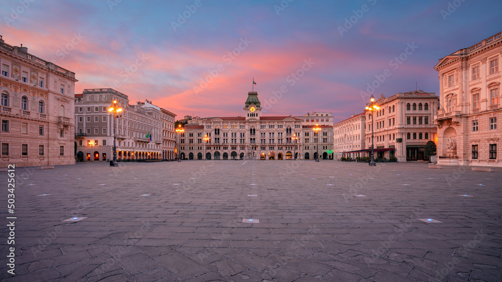 Trieste, Italy. Panoramic cityscape image of downtown Trieste, Italy with main square at dramatic sunrise.