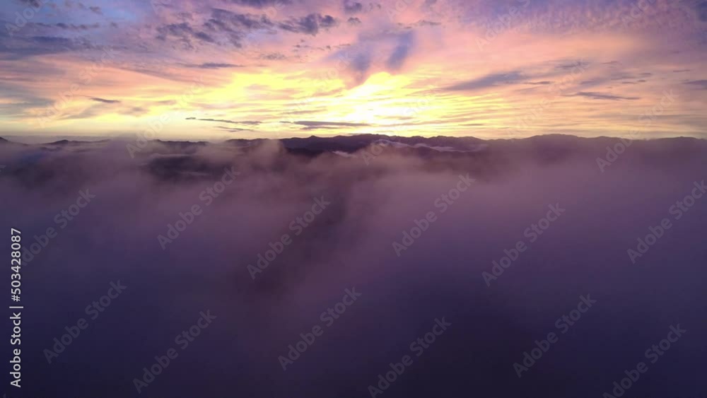 aerial drone view sun rays behind thick fog in dense forest, solar system background, stock video of the sun at dusk aerial drone view sun rays behind thick fog in dense forest, solar system background, stock video of the sun at dusk
