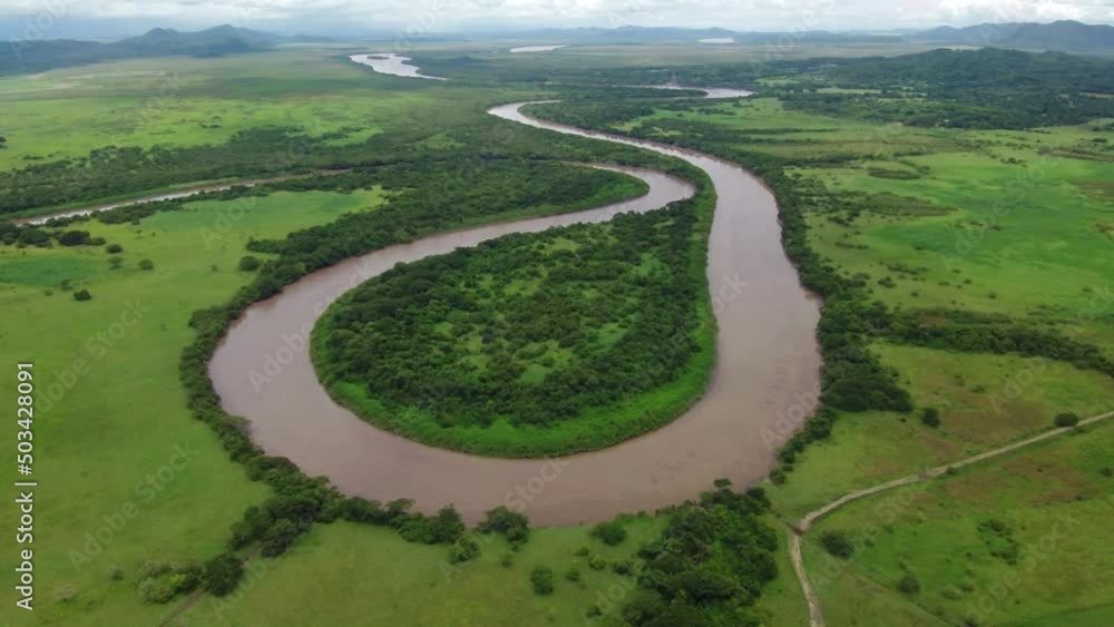 aerial drone shot view river meandering like a snake, tropical rain forest, natural wilderness aerial drone shot view river meandering like a snake, tropical rain forest, natural wilderness