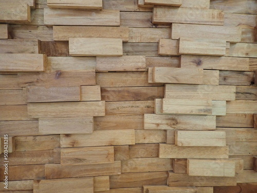the background of the stacked wooden wall of beautiful wall