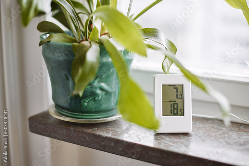 Thermometer on windowsill photo