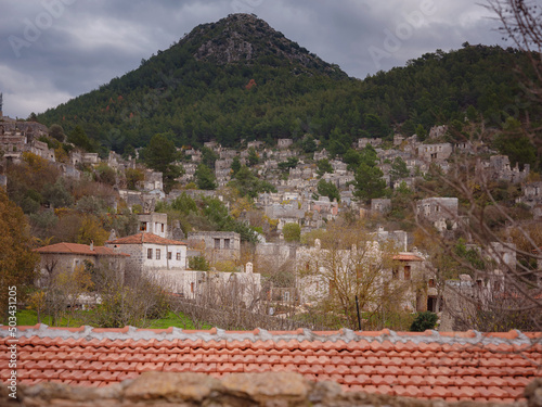 Abandoned Greek village Kayakoy ghost town in Fethiye Izmir Turkey. The site of 18th century Ancient Greek city of Karmilissos. photo