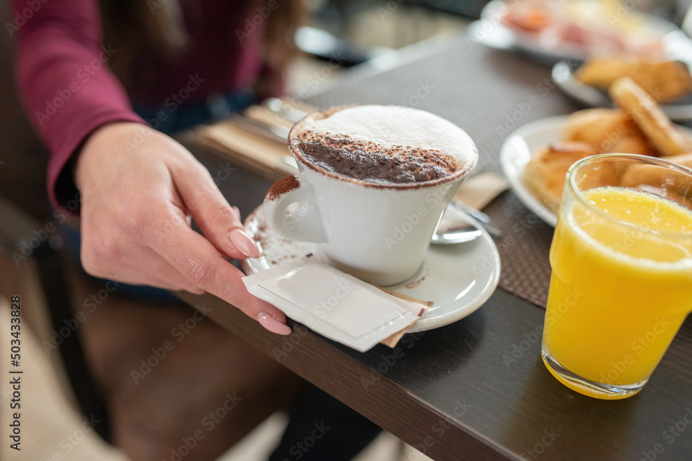 Breakfast with cappuccino, sweets and orange juice Breakfast with cappuccino, sweets and orange juice