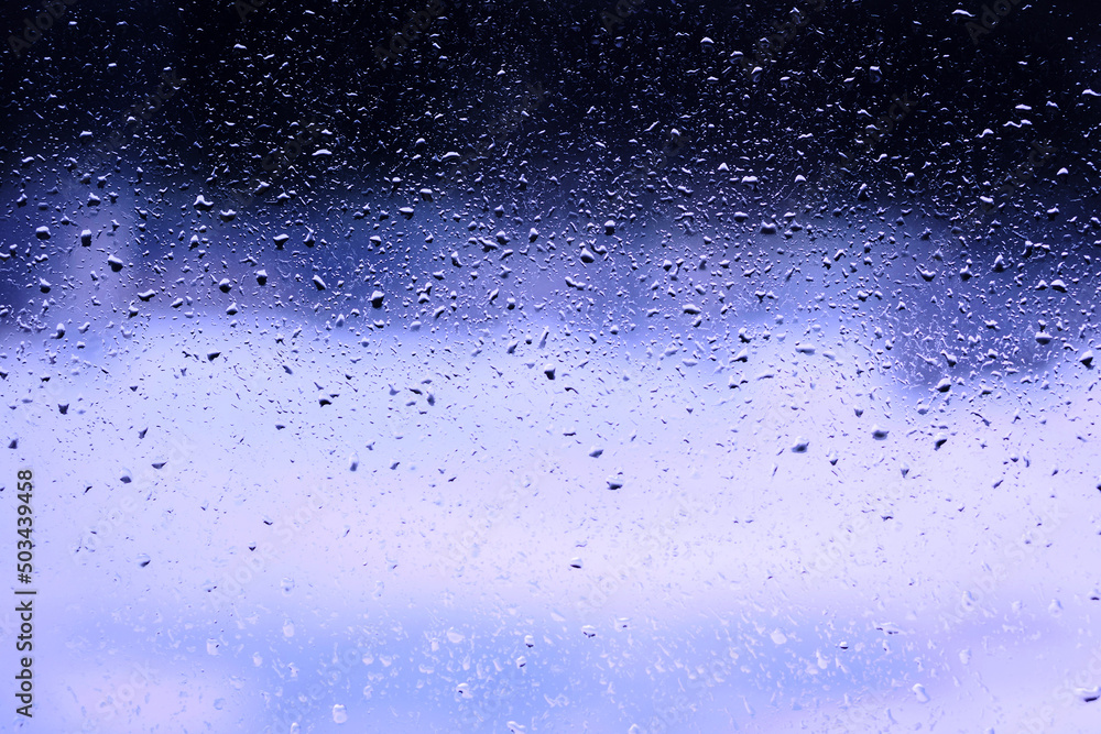 Obraz premium blue background water drops on the glass