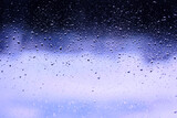 blue background water drops on the glass