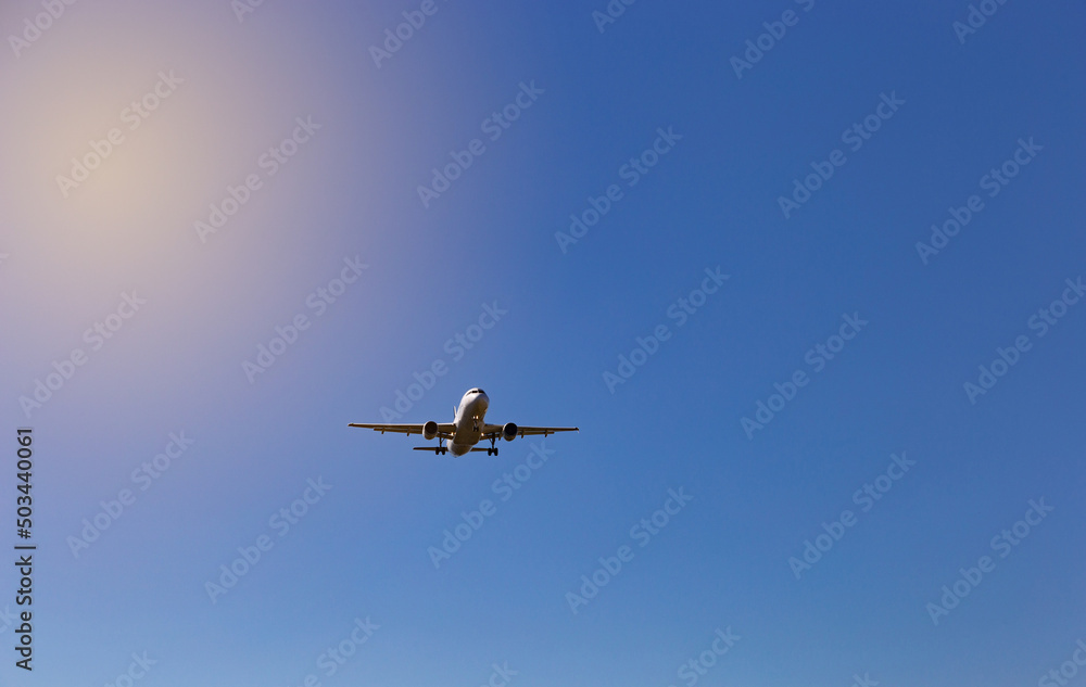 Airplane flying on the blue sky background. Airplane flying on the blue sky background.