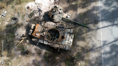 Smashed and burned russian tank. Burned tank. Tank crash. Top view. War in Ukraine.
