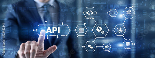 Application Programming Interface. API software development tool. Information technology concept. Businessman presses API text icon on a virtual interface