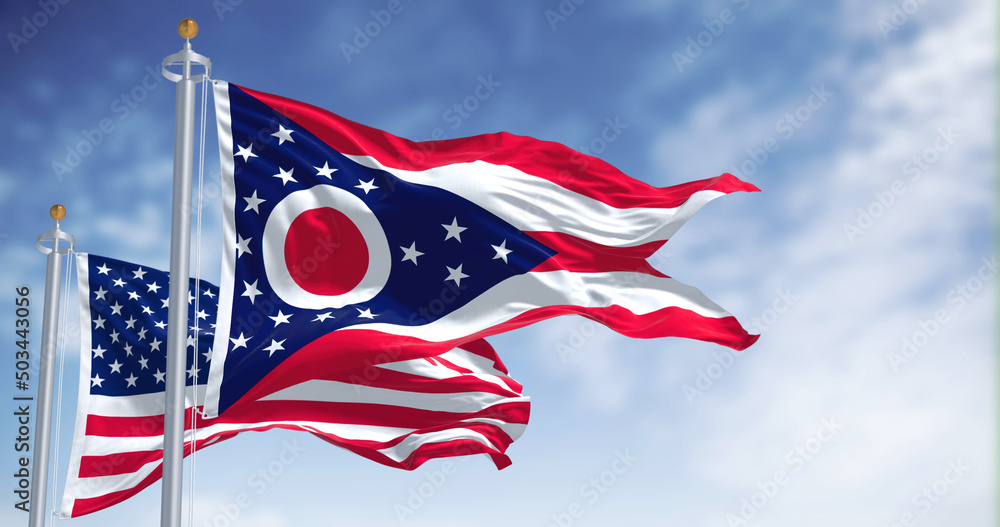 The Ohio state flag waving along with the national flag of the United