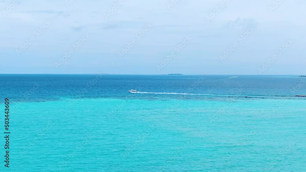 Drone flying under boat neat Maldive island Drone flying under boat neat Maldive island