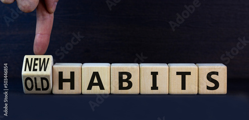 New or old habits symbol. Turned wooden cubes and changed concept words Old habits to New habits. Beautiful grey table grey background. Business old or new habits concept. Copy space.
