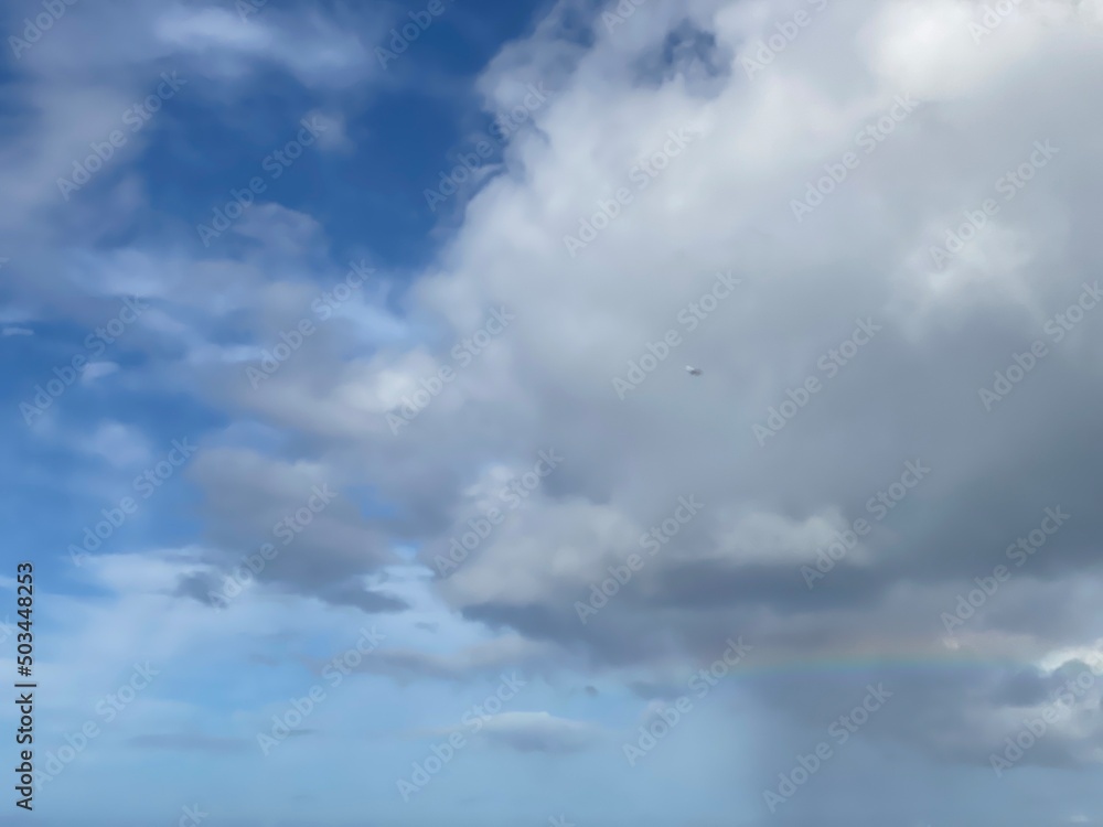 Long rainbow with dramatic clouds over the waikiki beach oahu Island, Hawaii year 2022 Long rainbow with dramatic clouds over the waikiki beach oahu Island, Hawaii year 2022