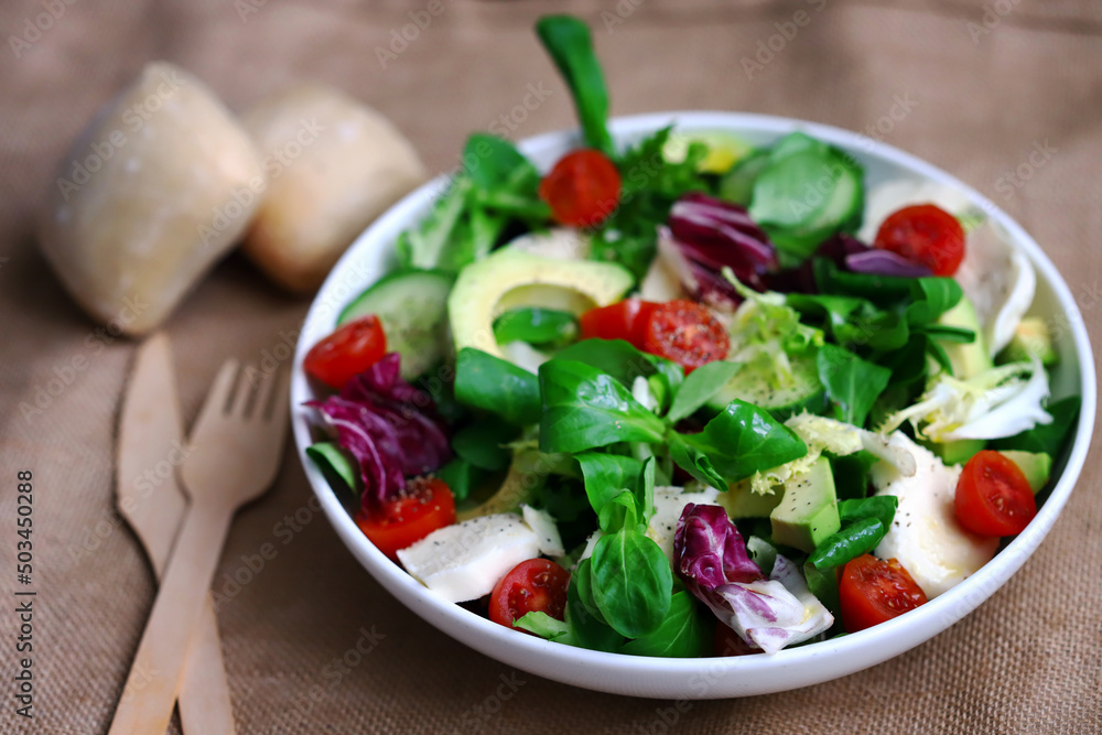Healthy salad with vegetables and avocado. Diet food. Healthy salad with vegetables and avocado. Diet food.