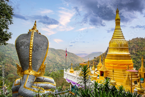 Golden Rock Temple or Wat Phra That Din Kwaen in Phrae province, Thailand photo