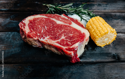 steak on dark wooden background pork beef