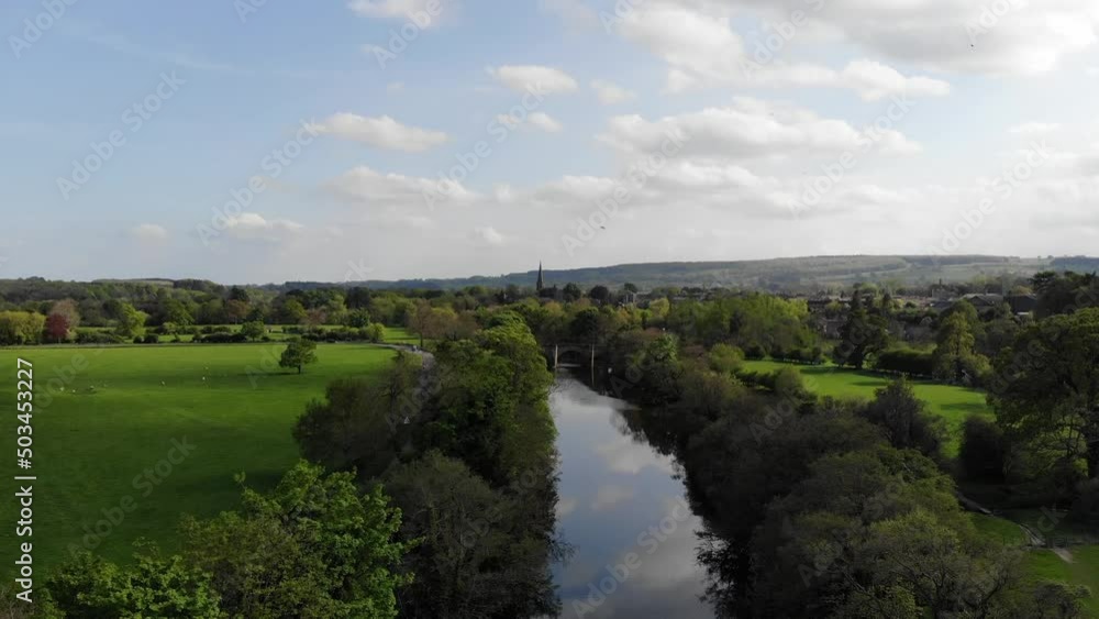Wild swallow birds flying over rural countryside stream in Yorkshire Dales Wild swallow birds flying over rural countryside stream in Yorkshire Dales