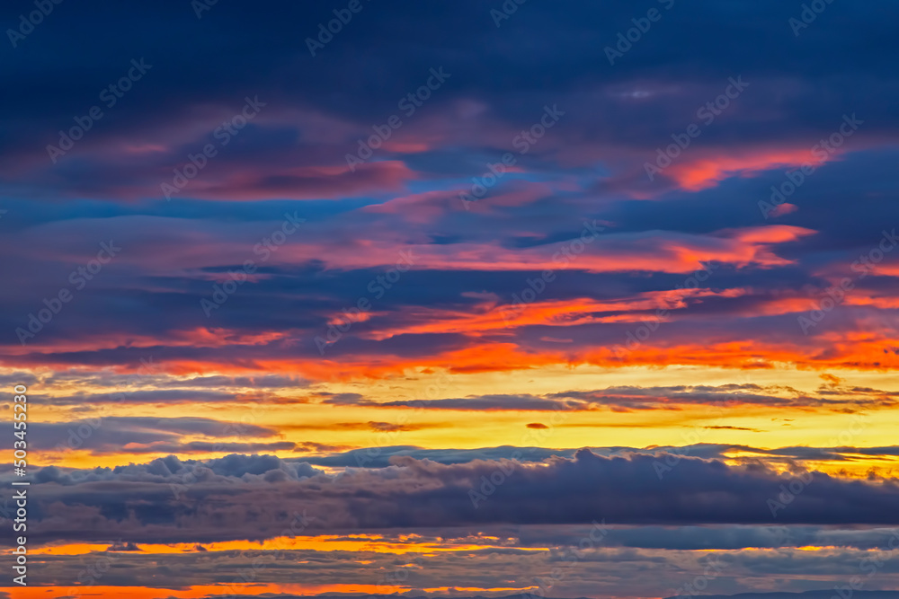 Unrealistic colorful sunset in the lush clouds in Iceland