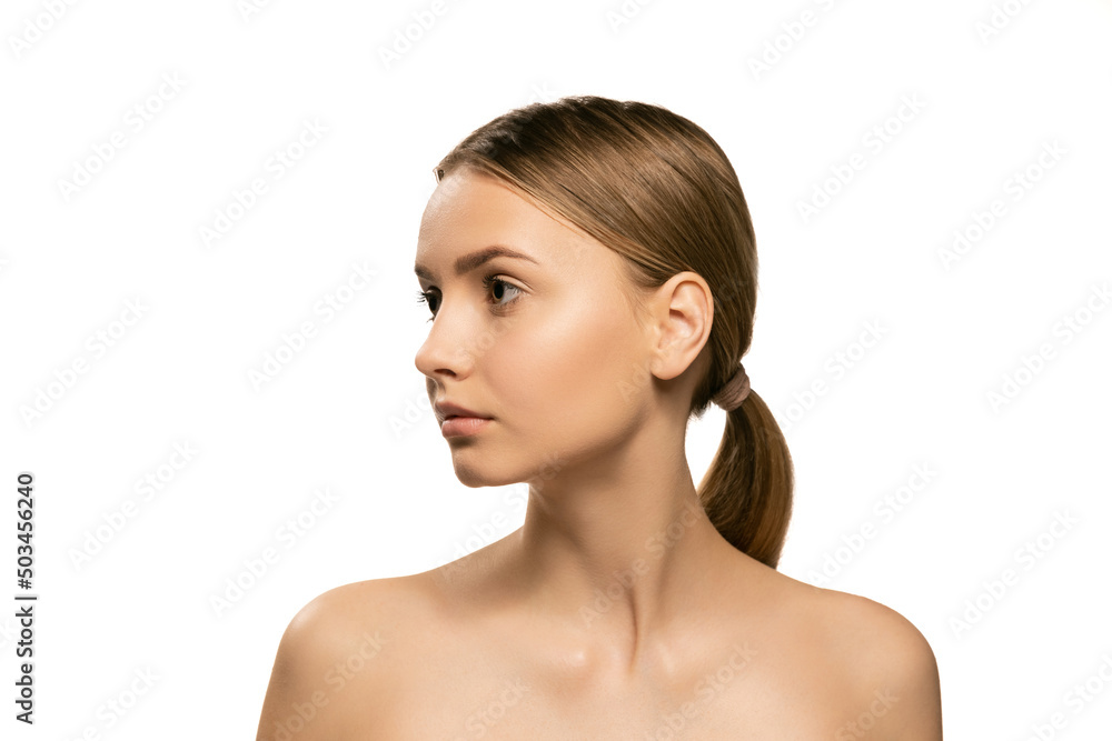Portrait of young female fashion model without makeup isolated on white studio background. Spa, surgery, face lifting and skin care concept Portrait of young female fashion model without makeup isolated on white studio background. Spa, surgery, face lifting and skin care concept
