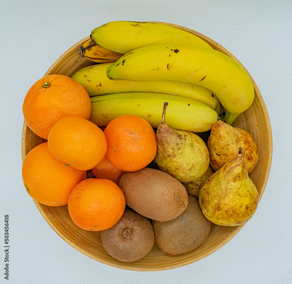 fruit bowl seen from above with orange, kiwi, banana and pear fruit bowl seen from above with orange, kiwi, banana and pear